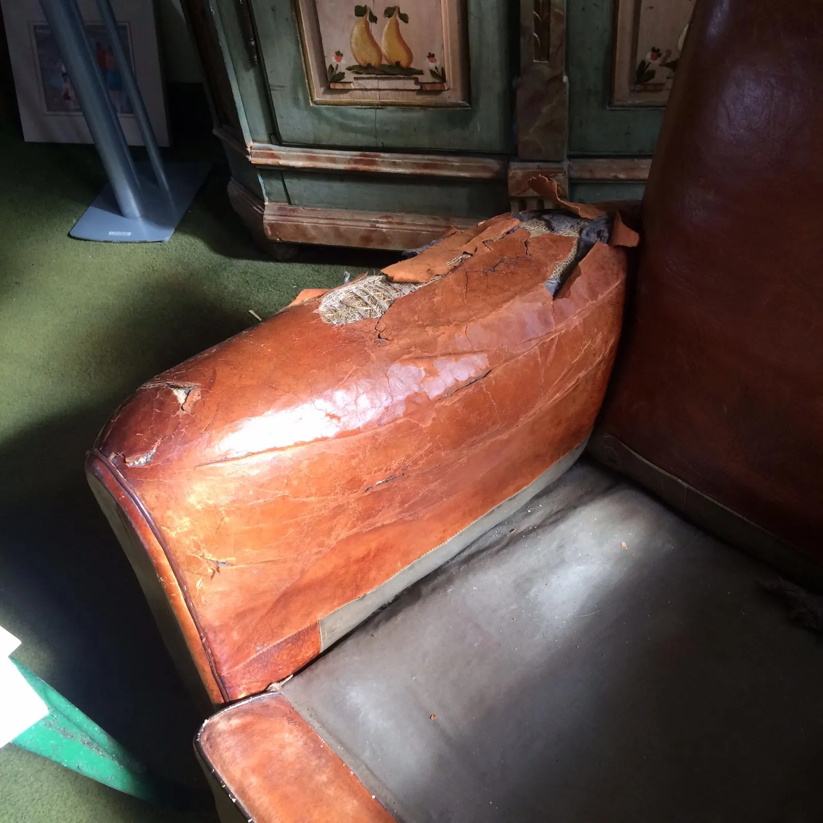 Replacement leather pieces being fitted during the restoration process